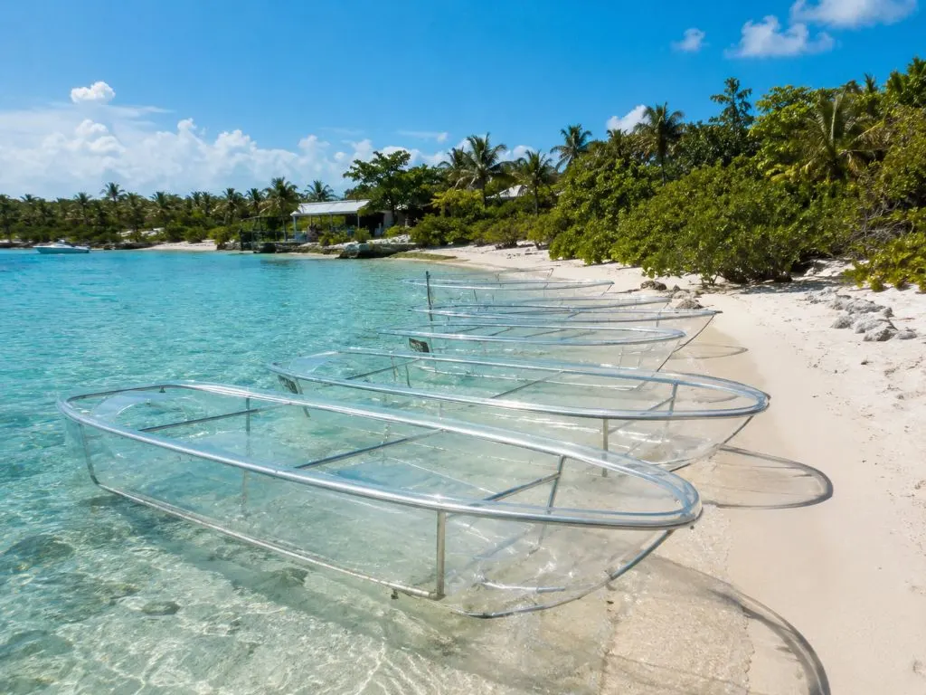 clear-boats-lined-up-on-beach-turks-and-caicos