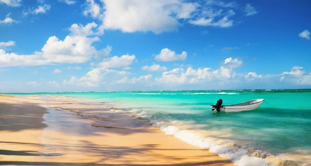 punta-cana-beach-boat-turquoise-water