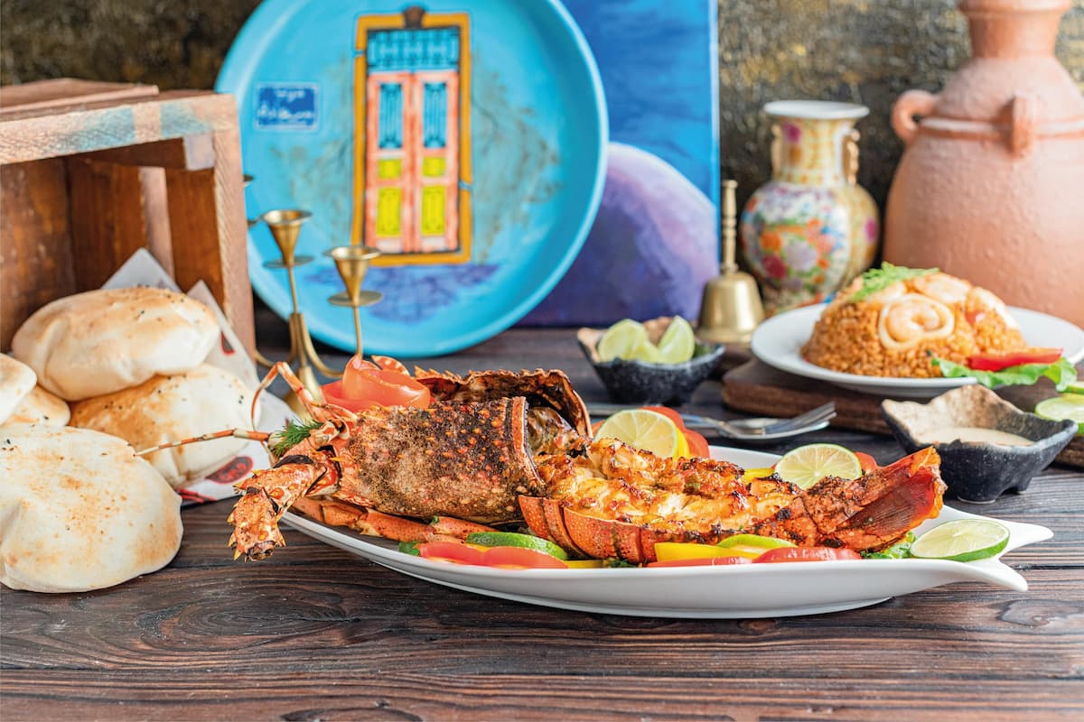 Lobster, rolls, and other regional Turks and Caicos dishes on a table