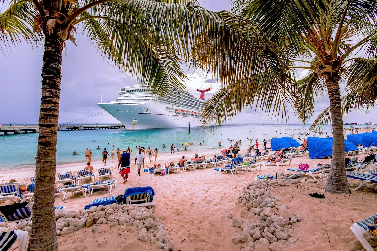 Cruise passengers spending time on Grand Turk with cruise ship in the background