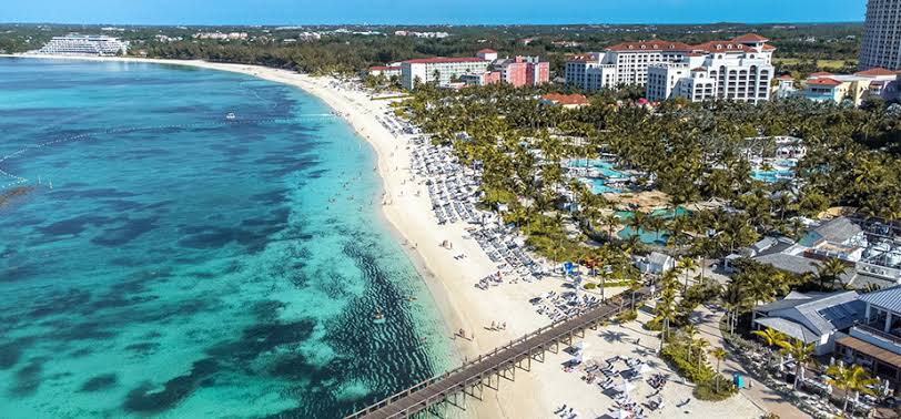 Cable Beach in Nassau, Bahamas, with calm shallow water in front of the resorts