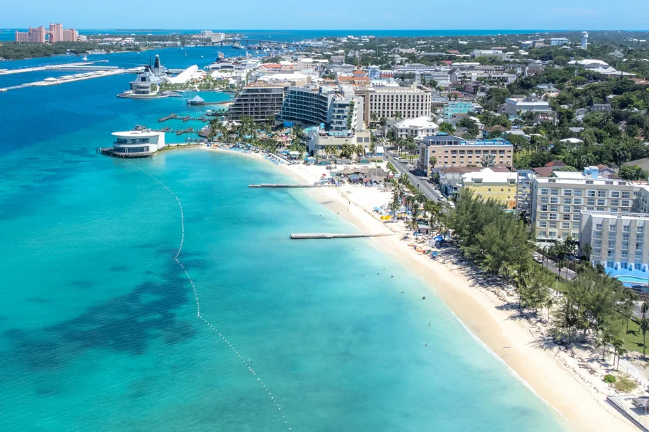 Junkanoo Beach in Nassau, Bahamas, with calm turquoise water and beach bars